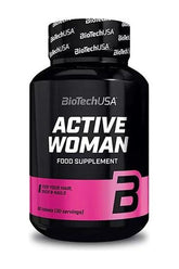 BioTechUSA Active Woman food supplement bottle with pink label for hair, skin, and nails, 60 tablets.